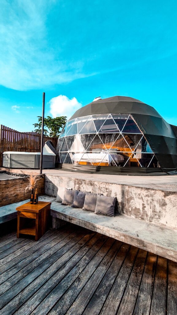 How to Plan a Group Retreat in Panama: A Guide for Retreat Leaders 2 Dome accommodation with a wooden terrace at Alaya Panama